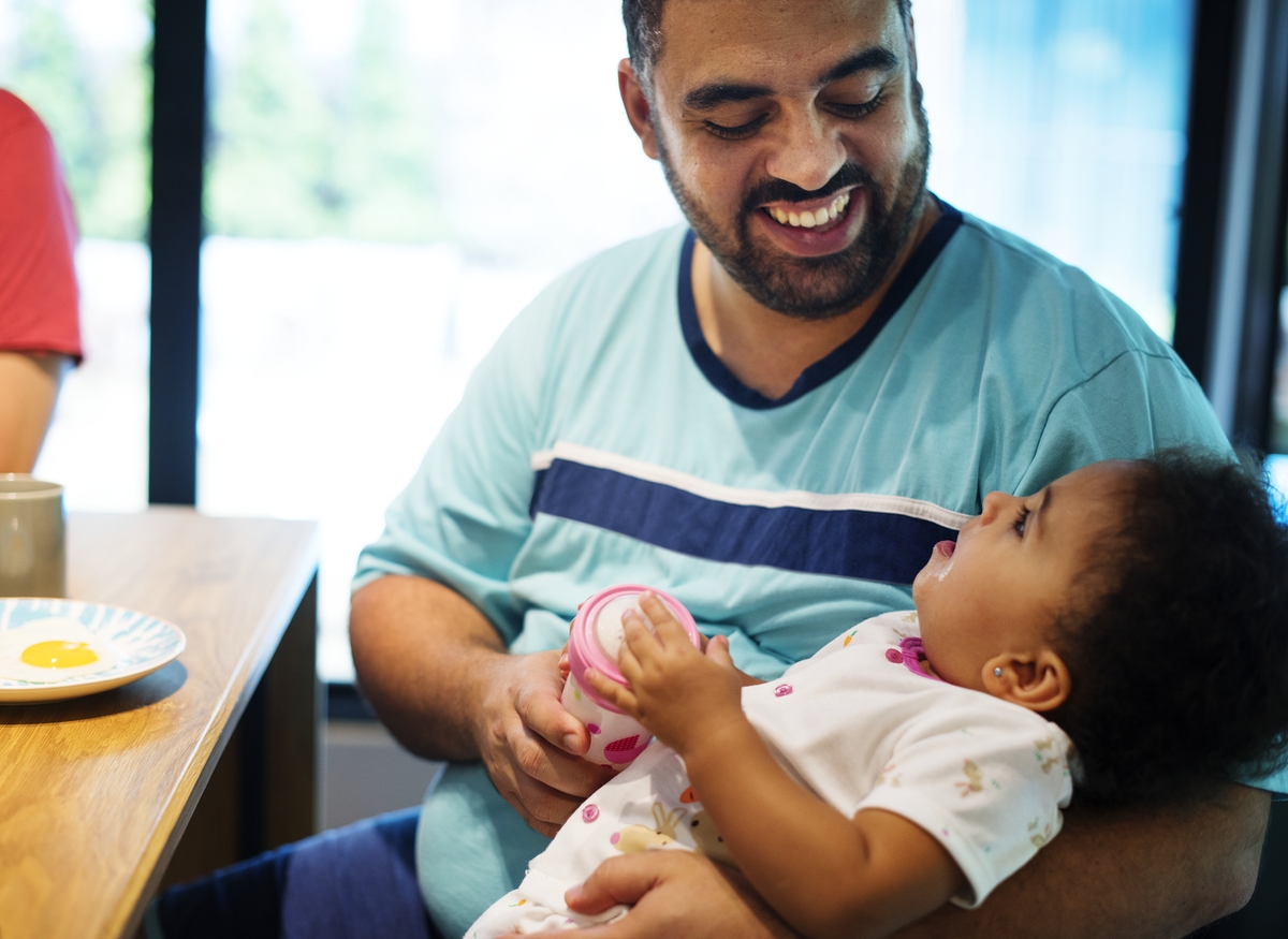 Dad bonding with baby daughter